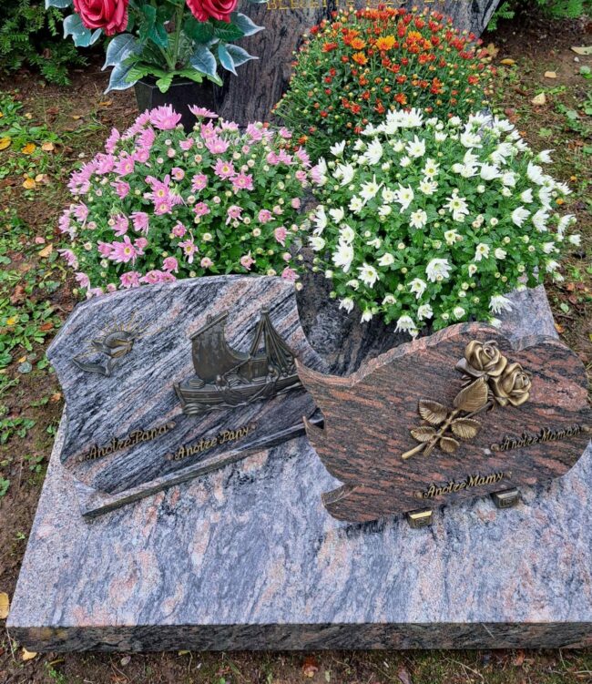 Pose de chrysanthèmes sur une cavurne